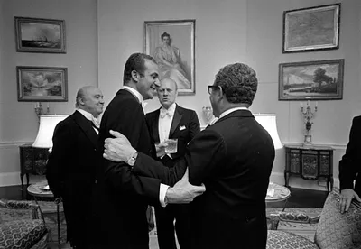 Spanish Foreign Minister José María de Areilza, King Juan Carlos I of Spain, President Gerald R. Ford, and Secretary of State Henry Kissinger at a Reception in the Yellow Oval Room Prior to State Dinner Held in Honor of the King and Queen of Spain