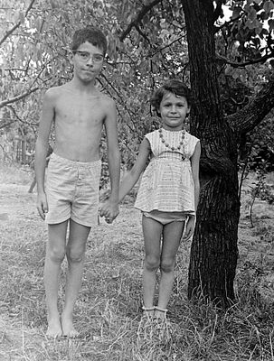 Children Holding Hands in a Rural Setting
