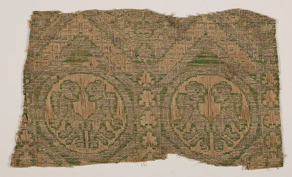 Fragment with chevron pattern and confronted lions in roundels
