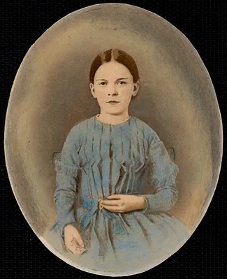 Portrait of young girl in a blue dress