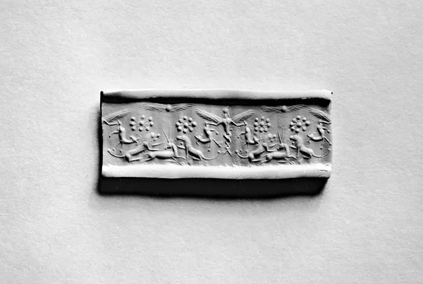 Cylinder Seal with a Winged Genius and Animals