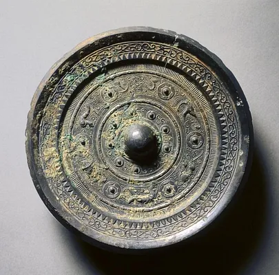 Mirror with Concentric Circles, an Immortal, and Auspicious Animals