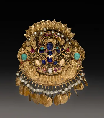 Pendant with Two-Armed Blue Deity on a Lotus with Nagas (serpent divinities)
