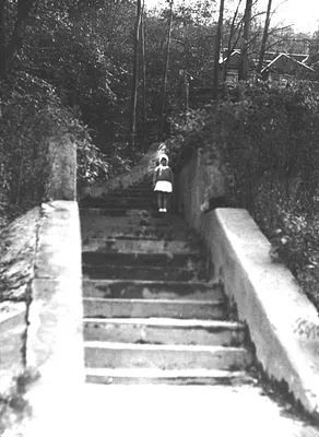Photograph of Girl on Steps to House