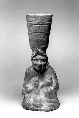 Lamp supported by a human figure with child