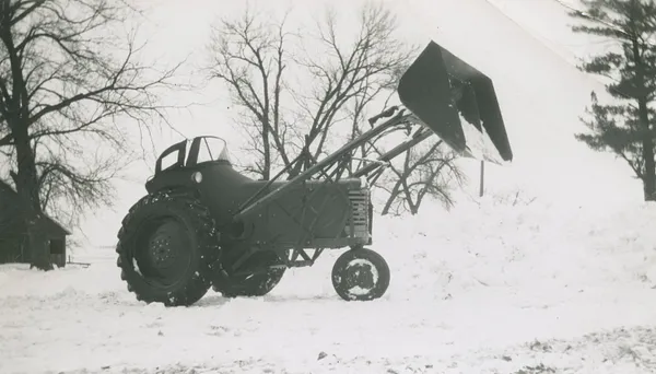 Lee Bull’s new tractor, ready to scoop snow after snow storm, 1950