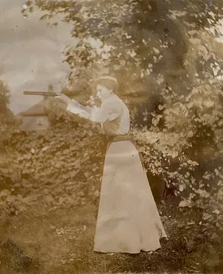 Unidentified woman sighting a rifle in Yarmouth Port, Mass.