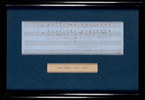 A framed score of music done in Lowell Mason's hand and dated 1858