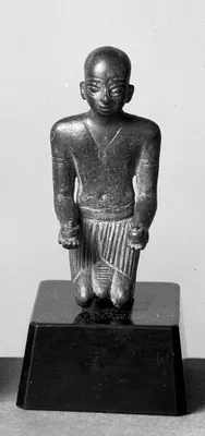 Kneeling Priest Offering Wine