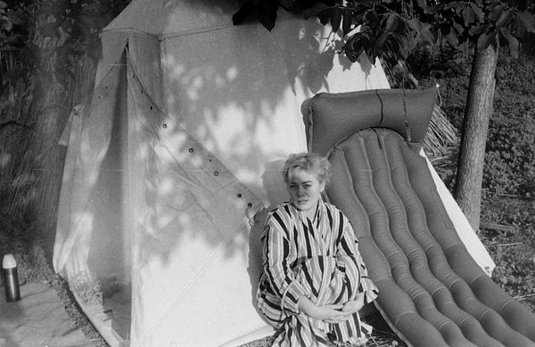 Young Woman by Camping Tent