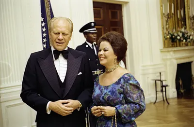President Gerald R. Ford and Chief of Protocol Shirley Temple Black Standing Together at a State Dinner Honoring the President of Finland