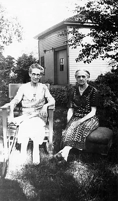 Mrs. Rachel France visits a friend in her backyard, 1940