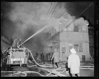 Street scene of firefighters fighting fire