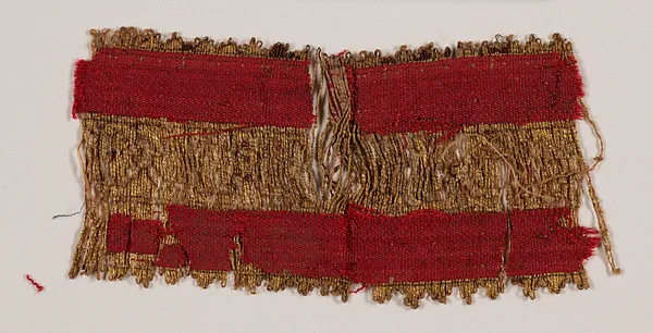 Fragment of red and gold border decoration