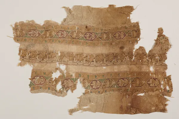 Tiraz fragment with decorative pands and inscriptions
