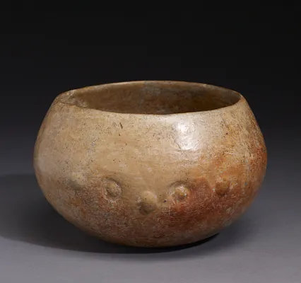 Bowl with faces on two sides