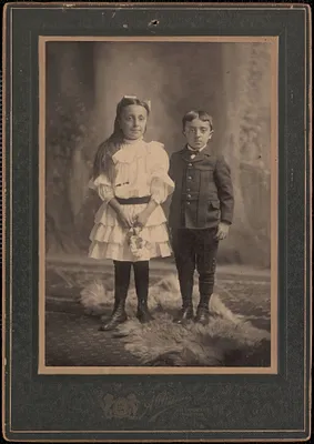 Studio portrait of a boy and a girl