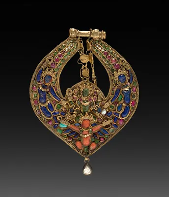 Deity Earring with Vishnu on Garuda (front) and chepu (monster mask) (back)