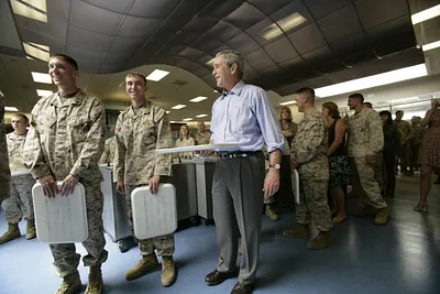 President George W. Bush Stands in the Chow Line with Marines