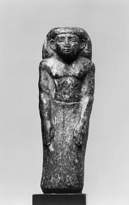 Prophet of Sobek Standing Against a Pillar