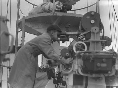 Photograph of a Boy on Deck of Ship