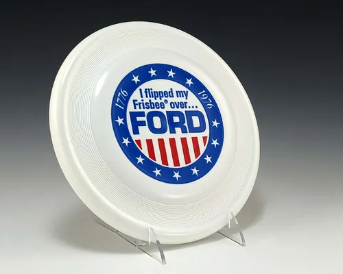 White Frisbee-Brand Flying Disc With Stars and Stripes Motif