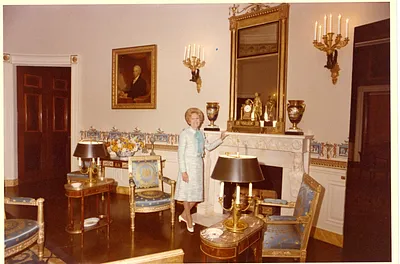 Pat Nixon Standing in the Blue Room, and receiving Flowers from Unidentified Men