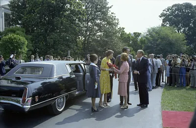 President Gerald R. Ford and First Lady Betty Ford with Chief of Protocol Shirley Temple Black Welcoming Prime Minister Malcolm Fraser and Mrs. Tamara Fraser of Australia in the South Driveway of the White House