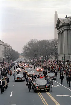 Inaugural Parade with the Reagans waving from limousine in Washington DC