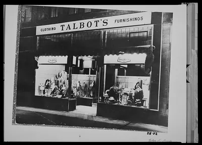 Night view of Talbot’s Clothing and Furnishings, Clark’s block, Main St.