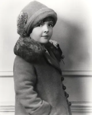 Photograph of a Young Nancy Reagan in Fur-Collared Coat and Hat