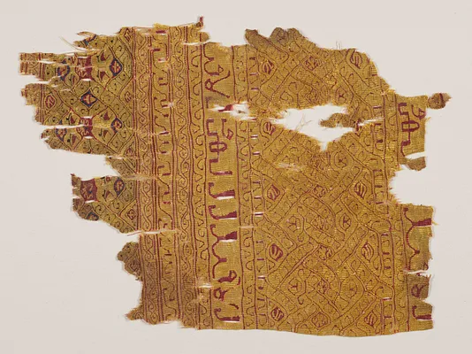 Tiraz fragment with tapestry woven bands of interlace and inscriptions