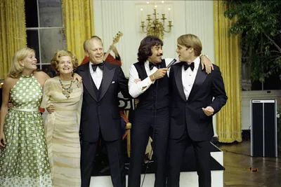 Susan Ford, First Lady Betty Ford, President Gerald R. Ford, and Jack Ford Singing Along with Tony Orlando following a State Dinner Honoring President Kekkonen of Finland