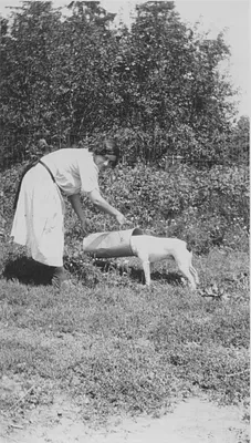 Victoria Rader with her dog, 1928