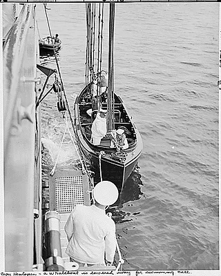Photograph of a whaleboat being lowered away from President Truman's yacht, the U.S.S. WILLIAMSBURG, for use while the President and others went for a swim at Cape Henlopen, during the vacation cruise to Rhode Island and Bermuda