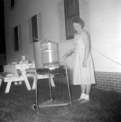 Woman Cooking on a Grill, Cedar Falls, 1966