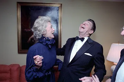 President Ronald Reagan laughing with Gloria Stewart at Wick's Dinner party at Watergate Hotel Washington DC