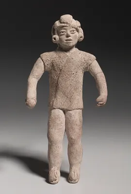 Figurine Holding A Ball(?)
