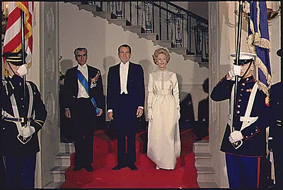 Mohammad Reza Pahlavi, Shah of Iran, President Richard Nixon, and Mrs. Nixon Entering a State Dinner in the White House