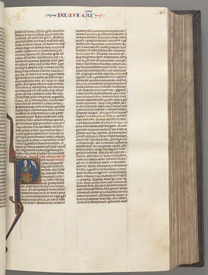 Fol. 86r, Judges, historiated initial R, Judah seated with a book talking to God