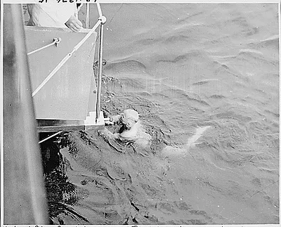 Photograph of President Truman enjoying a swim in the harbor at Cape Henlopen, during his cruise on the U.S.S. WILLIAMSBURG to Rhode Island and Bermuda