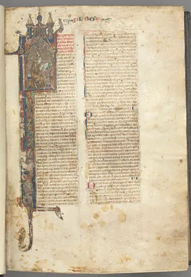 Fol. ir: Prologue, St. Jerome, large historiated initial I, the saint in a brown habit writing at a desk in a gothic architectural frame, with full-length border of foliage and small hybrids, a hare, a dog and a grotesque perched on the foliage extensions