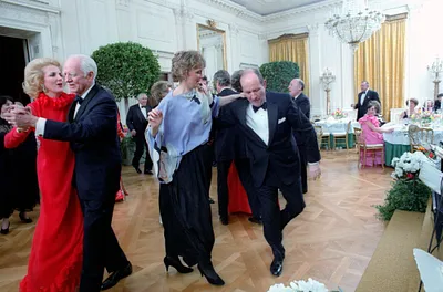 Michael Deaver dancing with Maureen Reagan at the President's 70th birthday party in the East Room