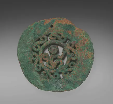 Medallion, beads, and spindle whorls