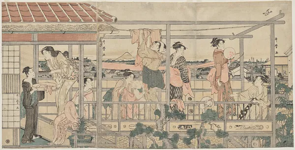 Women Hanging Laundry to Dry on a Balcony