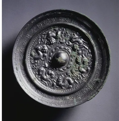 Mirror with Three Pairs of Bixie around a Loti-form Knob