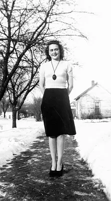 Woman on Snowy Sidewalk, United States, 1940