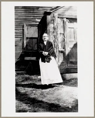 Woman standing by a door