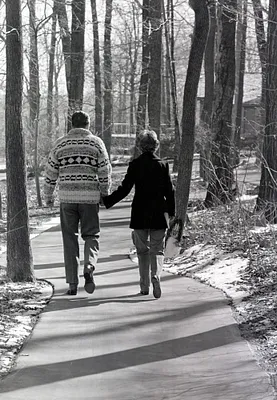 President and Nancy Reagan holding hands while walking at Camp David, Maryland