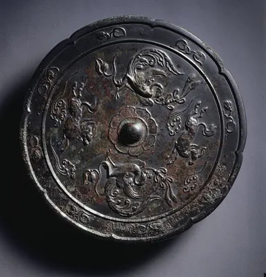 Lobed Mirror with Paired Phoenixes and Auspicious Animals